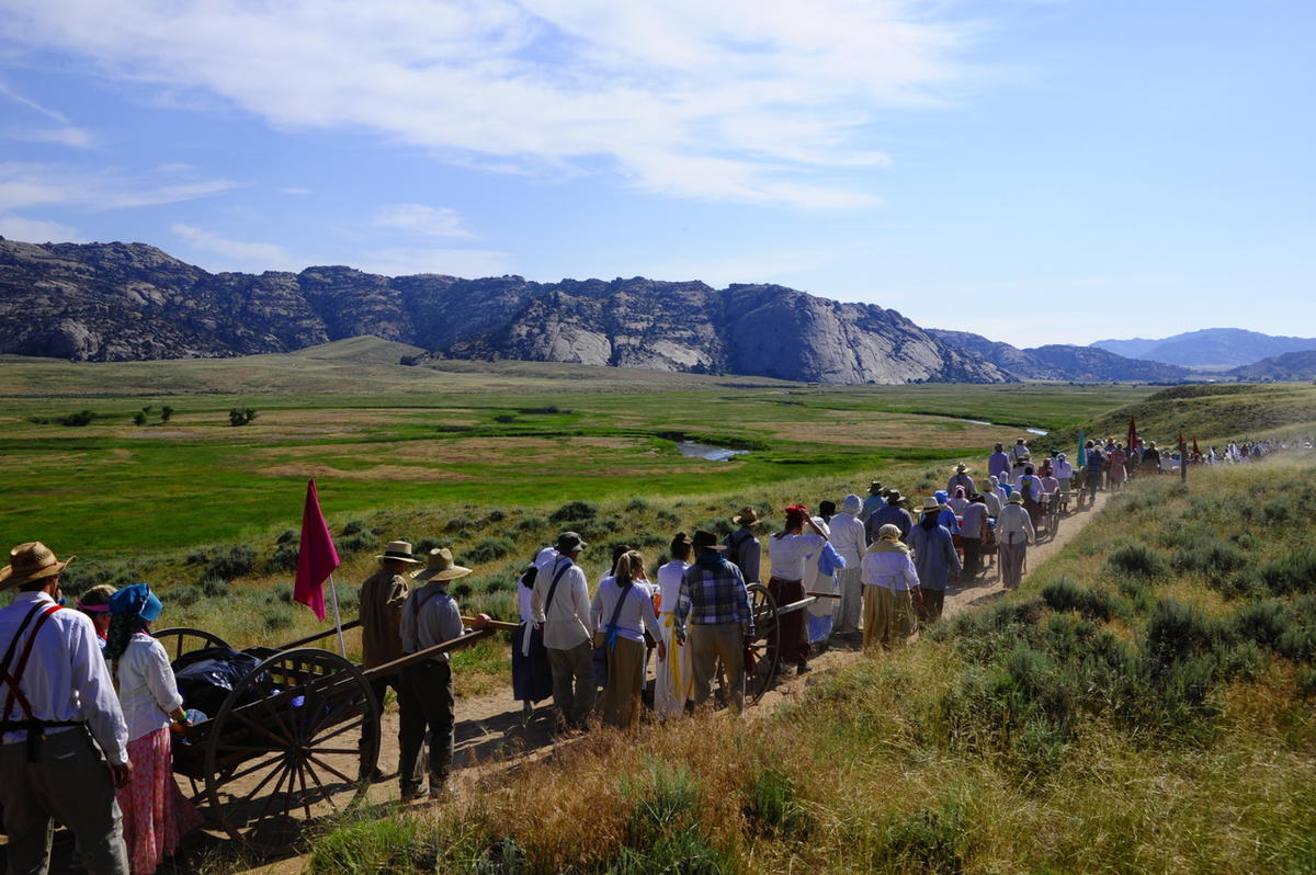 Trekkers pulling handcarts along the trail at Martin's Cove